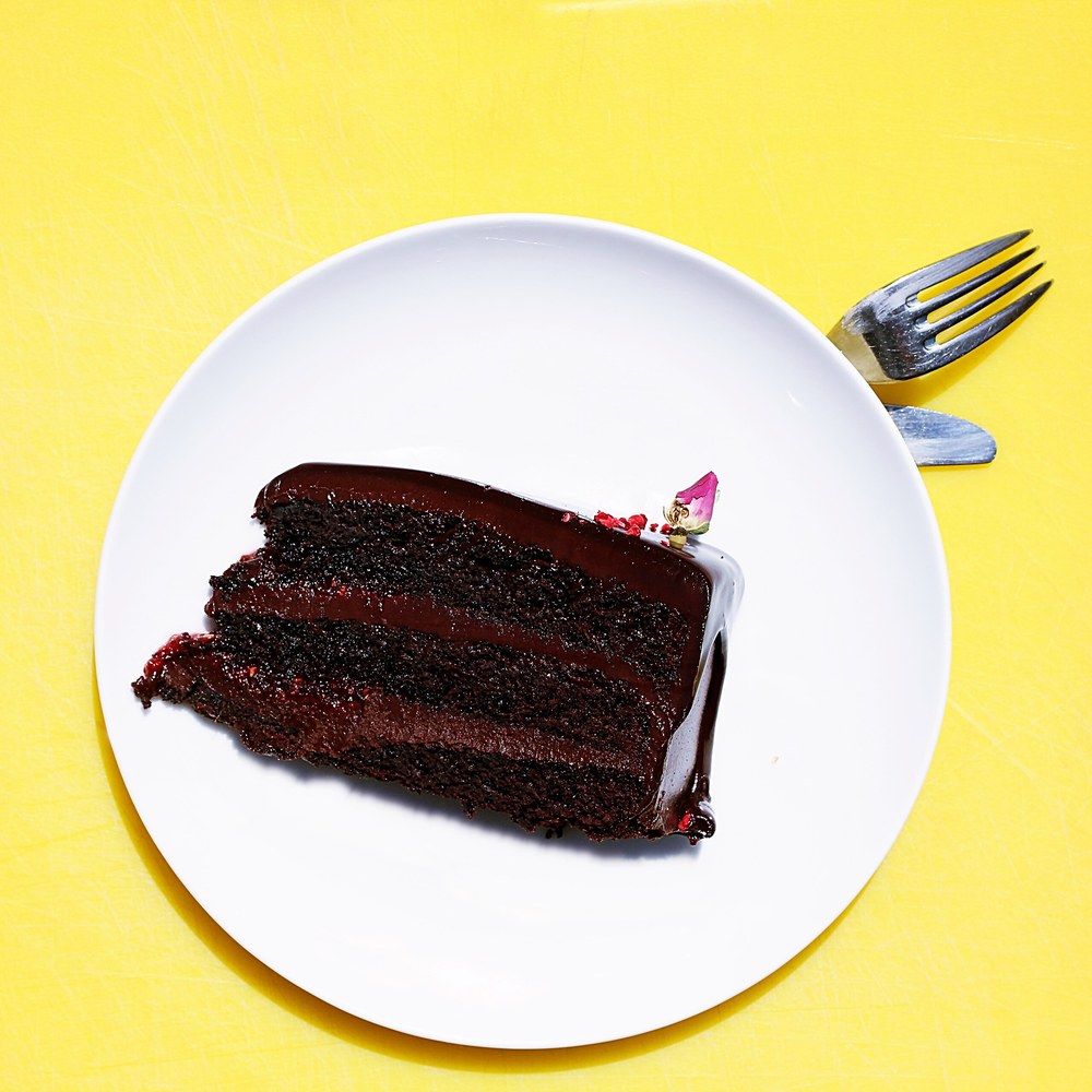 A rich chocolate cake with dark frosting