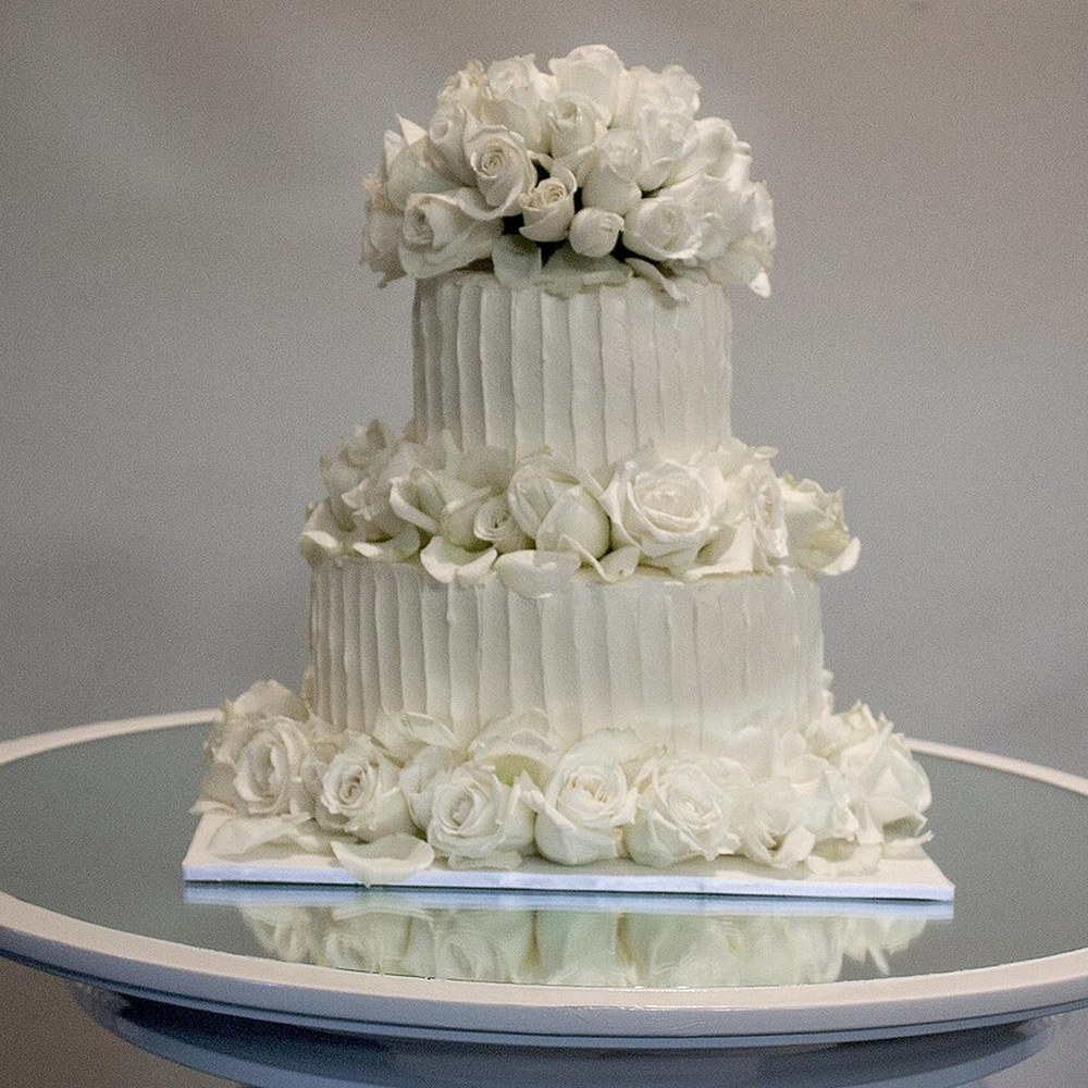 A two-tier wedding cake finished in Swiss buttercream
